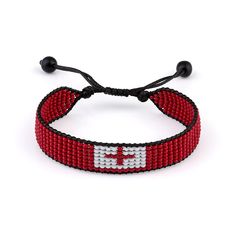 Embrace the vibrant spirit of Tonga with this eye-catching beaded bracelet. Crafted with care, this adjustable accessory features a boho-chic design that effortlessly blends the iconic red cross on a white background of the Tongan flag with colorful beads. Woven together with a sturdy rope, this bracelet is both stylish and durable, making it the perfect addition to your everyday look. Whether youre a proud Tongan or simply appreciate the beauty of cultural artistry, this bracelet is sure to become a cherished piece in your collection. Suitable for both women and men, its a versatile accessory that can be easily adjusted to fit most wrist sizes (up to approximately 8 inches or 20 cm in circumference). Embrace the spirit of wanderlust and let this vibrant bracelet be a reminder of the rich Adjustable Beaded Wrap Bracelet For Festivals, Adjustable Wrap Bracelet With Round Beads For Festivals, Adjustable Beaded Spiritual Friendship Bracelets, Adjustable Spiritual Beaded Friendship Bracelets, Adjustable Beaded Spiritual Friendship Bracelet, Adjustable Beaded Wristband For Festival, Adjustable Spiritual Beaded Friendship Bracelet, Adjustable Hand-strung Beaded Bracelets For Festivals, Adjustable Red Friendship Bracelets With Letter Beads