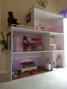 a doll house with furniture and accessories in it