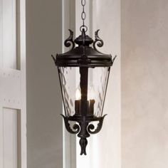 an old fashioned lantern hanging from the ceiling