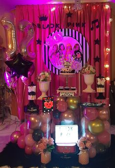 a birthday party with balloons and decorations