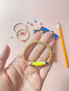 Back to School Teacher & Girl bracelets  These items are sold separately The most adorable bracelets.  Three options available: * Pencil & Gold Beads - 4mm gold hematite rounds. * Apple & Gold Beads  - 4mm gold hematite rounds. * Apple & Silver beads - 4mm silver plastic rounds.  All bracelets are made with stretchy elastic and knotted closure. These items are sold separately. Sizing: Girls & Adults - 5.5 inches / Toddler 3-5 years  - 6 inches    / Girls 6-8 years  - 6.5 inches / Small Adult  - Back To School Bracelets, Pencil Bracelet, Spring Bracelet, Girl Accessories, Bracelets Jewelry, Cute Bracelets, School Teacher, Girls Accessories, Gold Beads