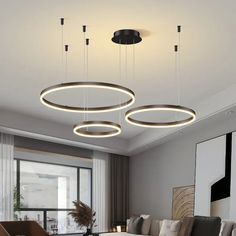 modern living room with round lights hanging from the ceiling