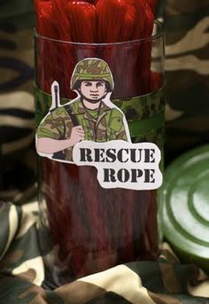 a red candle with a sticker that says rescue rope