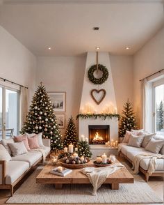 a living room decorated for christmas with candles and decorations on the fireplace mantels