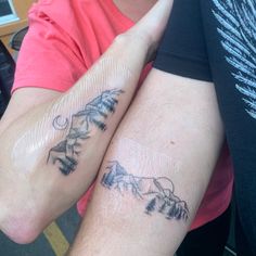 two people with matching tattoos on their arms