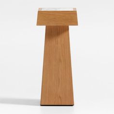 a small wooden table with a glass top on it's side, against a white background