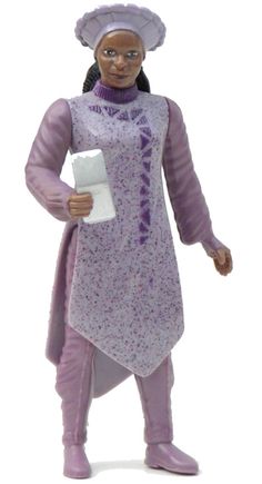 a figurine of a woman holding a piece of paper