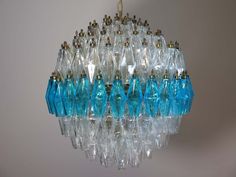 a blue chandelier hanging from a ceiling