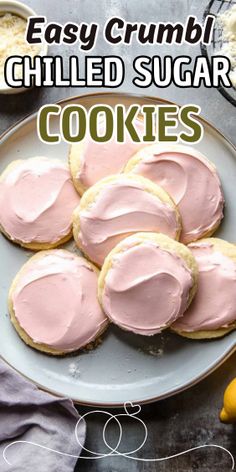 some cookies with pink frosting on a plate