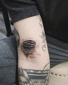 a person with a tattoo on their arm