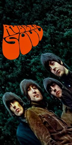 the beatles are standing in front of some bushes and trees with an orange sign above them