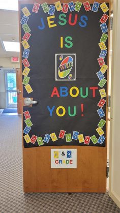 a bulletin board with the words jesus is about you on it in front of a door