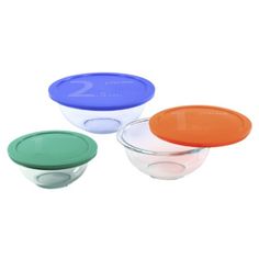 plastic bowls with lids are stacked on top of each other in different colors and sizes