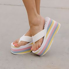 Calling all rainbow queens! The Rocket Dog Bigtop Pastel Platform Flip Flop is here to add a splash of color to your summer strut. ☁️ These white-hot flip flops with a pastel rainbow EVA platform are like walking on sunshine, but way comfier. Plus, with an almost 4 inch wedge heel, you'll be catching all the vibes (and maybe a few extra inches of height) wherever you go. ✌️☀️ Style: Rocket Dog Women's Platform Flip Flop Sandal Color: White with pastel platform Straps: White Webbing Straps Upper Material: Woven Synthetic Platform Bottom: Pastel Rainbow EVA Platform for Extra Comfort Platform Height: 2.5 inches Heel Height: 3.87 inches Comfy Wedges, Knee High Boots Winter, Platform Flip Flops, Rocket Dog, White Hot, New Sneakers, Boots Knee, Sandals For Sale, 5 Inch Heels