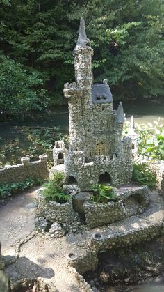 a castle made out of rocks in the woods