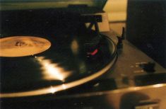 an old record player sitting on top of a turntable