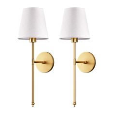 two wall lamps with white shades on each lamp, one is gold and the other is white