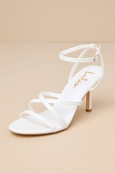 The Lulus Sheriden White Strappy High Heel Sandals exude a simply stunning aura that'll be an incredible addition to any fabulous 'fit! Smooth faux leather shapes these must-have heels that feature an almond-shaped footbed, a slender toe strap, and matching straps that crisscross at the vamp. Additional straps sprout from the sides to wrap and secure around the ankle with a dainty silver buckle. An eye-catching stiletto heel lends an extra-flirty finish to the chic design. 3. 25" wrapped stilett White Strappy High Heels, Ankle Wrap Heels, Strappy High Heels Sandals, Fashion Shoes Heels, Classy Prom Dresses, Strappy High Heels, Almond Shaped, Size 11 Heels, Sandal Heels