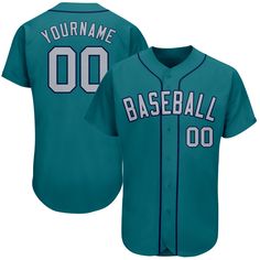 a teal baseball jersey with the name and number on it, that reads'your name