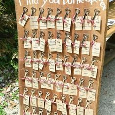 a wooden sign with lots of keys attached to it