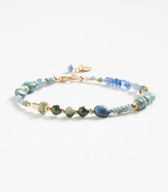 Polish your look with this unique Bohemian-inspired bracelet that is crafted from natural green moss and blue kyanite. Material: Green moss and Blue Kyanite stones Dimensions: 7.5"L, 1" extender Made in USA Due to the natural characteristics of this item, each piece will have variances, no two are exactly the same. Beaded Gemstone Bracelets, Kyanite Bracelet, Bracelet Inspiration, Group Gifts, Jewelry Beads, Bracelet Ideas, Blue Kyanite, Jewelry Inspo, Blue Bracelet