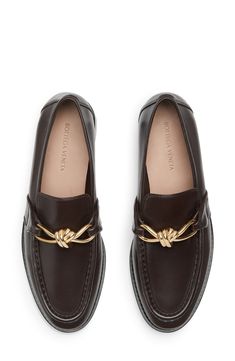 The label's signature knot hardware serves as the shining bit on an elevated loafer crafted from supple napa leather with a raised apron toe. Leather upper, lining and sole Made in Italy Designer Shoes Men Shoe Closet, Bottega Veneta Shoes Men, Work Shoes Winter, Loafers Aesthetic, Bottega Veneta Fashion, Mens Loafer, Womens Loafers, Designer Loafers, Loafers Outfit