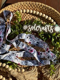 a woven basket filled with lots of green plants next to a sign that says solcaries