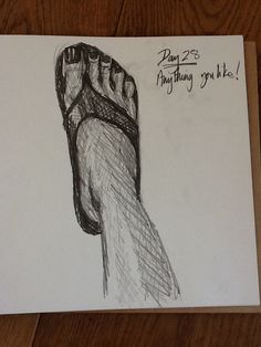 a drawing of a person's foot on a piece of paper