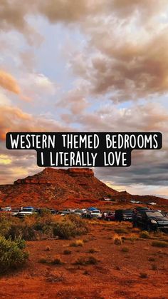 there is a sign that says western themed bedroom's i literally love the mountains in the background