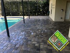 a sign is laying on the ground in front of a swimming pool that has been cleaned