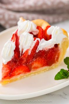 a slice of strawberry pie with whipped cream on top