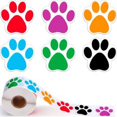 a roll of colorful paw prints on a white background next to several different colored paws