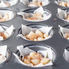 several muffin tins filled with different types of food