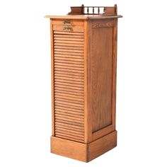 a wooden cabinet with shutters on the top and bottom, sitting against a white background