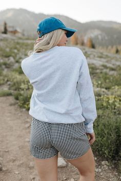 Go for a winning look with THE 98 SWEATSHIRT IN ASH. The oversized fit and grey fabric provide ultimate comfort, while the bold 98 graphic and red numbers give off a cool and sporty vibe. Perfect for both athletic and chic styles. Paired with THE MADA BOXER SHORTS IN BLACK AND WHITE GINGHAM and THE LOS ANGELES BASEBALL HAT IN ROYAL BLUE Oversized fit 98 graphic printed Premium cotton Unisex sizing 100% cotton Oversized fit. Small/Medium (0-6), Medium/Large (6-12) Model is 5'5" wearing a size sma Happy Threads, Summer Goddess, Pink Desert, Black And White Gingham, Exclusive Clothing, Boxer Shorts, Swim Bottoms, Baseball Hat, British Indian