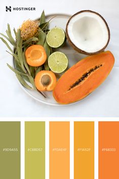 a plate filled with fruit and vegetables on top of a white table covered in color swatches