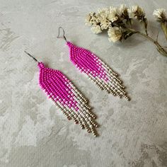 Brighten your everyday outfit with these long hot pink beaded earrings with fringe. Inspired by tribal style, these bright waterfall earrings have a white/silver gradient that will sparkle with every move. These ombre seed bead earrings make an eye-catching addition to any outfit. If you're looking for pageant earrings in magenta or fuchsia color, this pair is the perfect finding for you. It is a great gift for anybody who loves statement earrings. Length: 3.5''/ 8,9 cm Width: 0.8''/ 2 cm Material: Czech seed beads, stainless steel accessories. 100% top quality handmade earrings The real color of the item may be slightly different from the picture shown on the website caused by your monitor's brightness. If you have special size requirements, please send me a letter about it, as this can b Hot Pink Beaded Earrings, Pink Seed Bead Earrings, Pink Beaded Earrings, Silver Gradient, Waterfall Earrings, Long Beaded Earrings, Native Earrings, Pageant Earrings, Long Hots