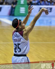 a basketball player reaching up to grab the ball