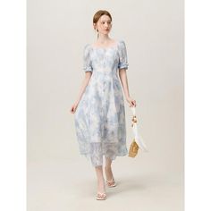 Embrace the charm of summer with our Summer Elegance Blue Floral Dress. Designed for the sophisticated woman who appreciates a blend of classic style and contemporary fashion, this dress promises versatility and comfort for any occasion. Whether you're heading to the office or attending a weekend brunch, this dress ensures you look effortlessly chic. Key Features Style: A-Line silhouette paired with a modest O-neck, creating an elegant profile that flatters all body types. Material: Crafted from high-quality polyester, offering durability, breathability, and easy maintenance. Sleeve Design: Short sleeves that balance style and comfort, perfect for warmer days. Length & Fit: Mid-calf length that provides ample coverage while maintaining a playful, airy feel. Slim fit design accentuates your Blue A-line Maxi Dress For Summer, Elegant Maxi Dress For Daytime Summer, Feminine Blue A-line Midi Dress, Elegant Square Neck Midi Dress For Beach, Elegant Light Blue Square Neck Dress, Light Blue Square Neck Summer Dress, Chic Blue Summer Midi Dress, Elegant Summer Midi Dress For Daytime, Blue Chic Midi Dress For Summer