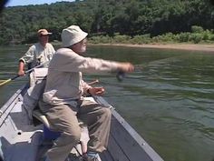 two men on a boat in the water