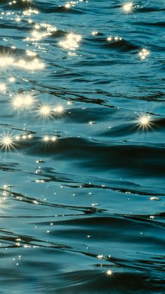 the sun shines brightly in the water as it reflects on the surface of the ocean