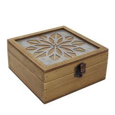 a wooden box with a cut out design on the lid