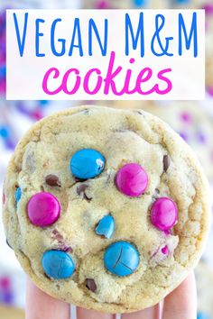 vegan m & m cookies with pink, blue and chocolate chips in the middle