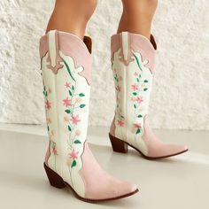 These floral cowboy boots feature a pink and white leather construction with detailed floral embroidery. They have a classic pointed toe, curved top edges, and a modest stacked heel Material: Vegan Leather Run small, please review the sizing information Floral Cowboy Boots, Knee High Cowgirl Boots, High Cowgirl Boots, Cowgirls Boots, Cowboy Embroidery, Embroidery Boots, Pink Cowboy Boots, Pink Cowboy, Popular Boots