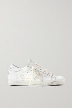 EXCLUSIVE AT NET-A-PORTER. Made in Italy from white leather, Golden Goose's 'Superstar' sneakers have been carefully hand-distressed by artisans in the brand's Venetian atelier - so while this pair looks love-worn, it feels brand new. They're embellished with lustrous faux pearls filling in the signature star. -- Rubber sole measures approximately 25mm/ 1 inch - White leather (Cow) - Lace-up front - Made in Italy White Sneakers Designer, Clean Golden Goose Sneakers, Pearl Golden Goose, Golden Goose Wedding Shoes, Embellished Leather Sneakers For Streetwear, Sporty Low-top Embellished Sneakers, Sporty Embellished Low-top Sneakers, Wedding Golden Goose, Embellished Leather Lace-up Sneakers