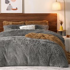 a bed with grey and brown fur on it