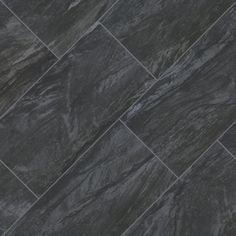 a black tile floor with grey lines on it