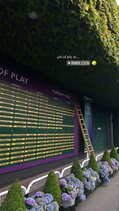 there is a tennis racket on display in front of the scoreboard at wimbledon