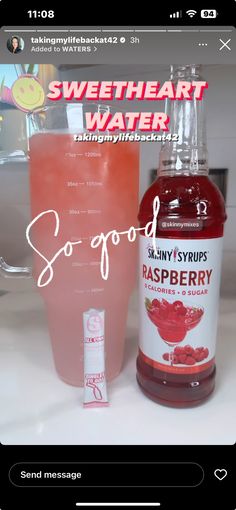 a bottle of soda next to a shaker filled with raspberry flavored water