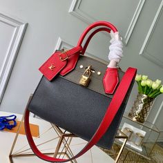 For Spring-Summer 2019,Louis Vuitton reintroduces the City Steamer Mini handbag and restyles its colorway to emphasize its distinctive lines: black grained calfskin combined with khaki green and scarlet red Handbag Wallet, Wallet Accessories, Vuitton Bag, Handbag Accessories